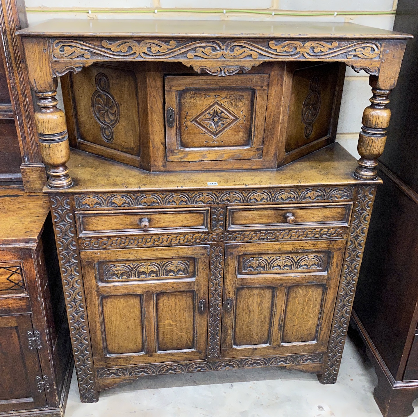 A reproduction 18th century style oak court cupboard width 106cm, depth 46cm, height 137cm.